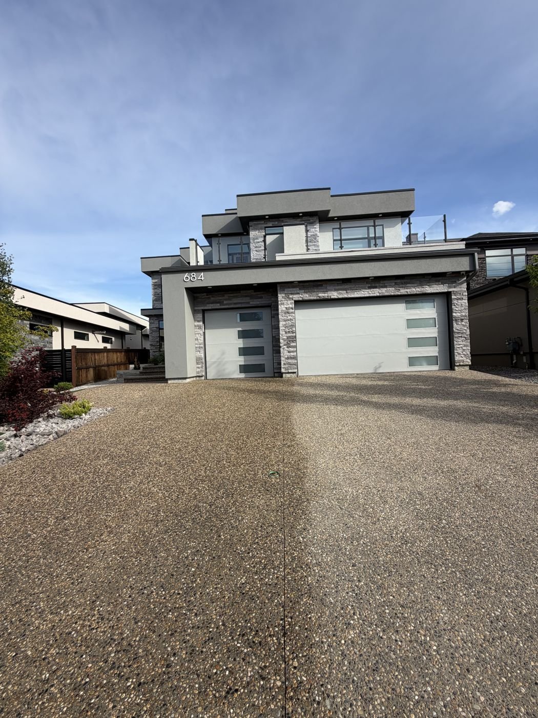 Wide-angle view of a finished sealed driveway, Edmonton home