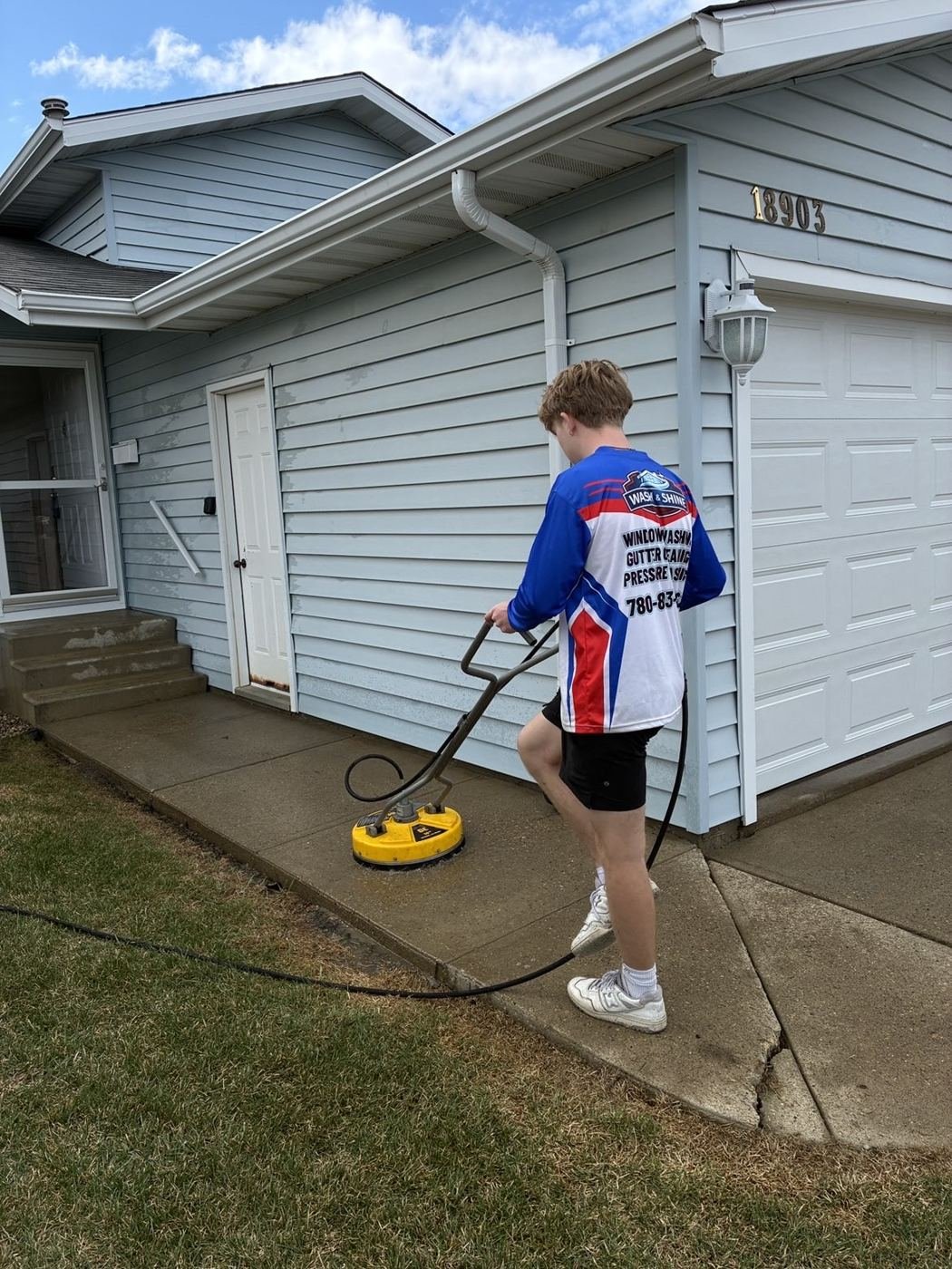 Surface cleaner attachment removing grime from concrete