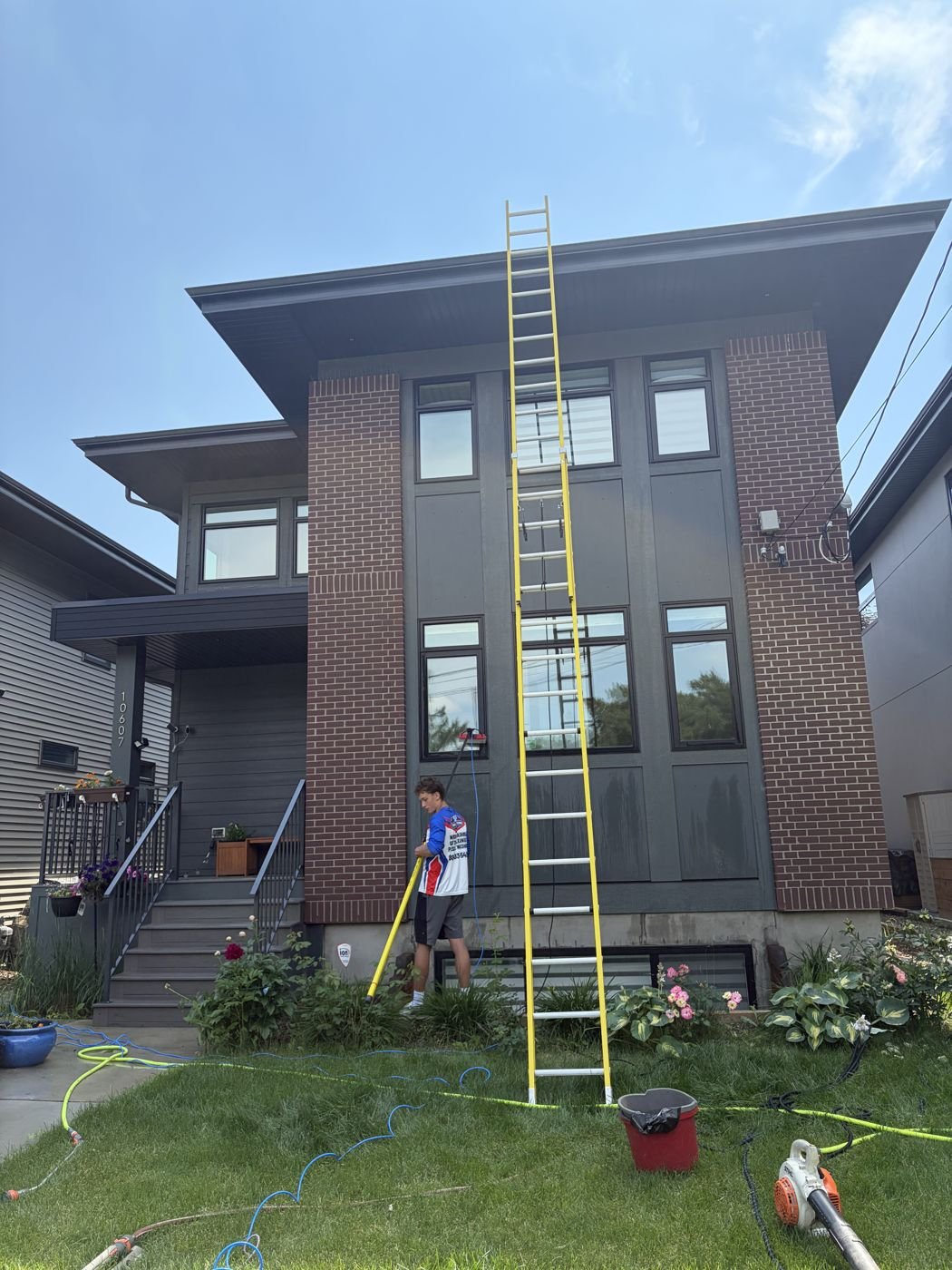 Extension ladder set up for a tall window cleaning job