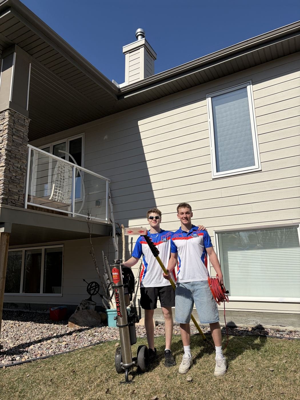 Two Wash & Shine Co. team members on a job site